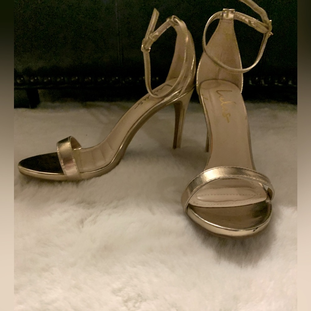Lulu’s gold strappy stilletos